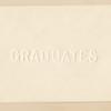 Card embossed with the word "GRADUATES"